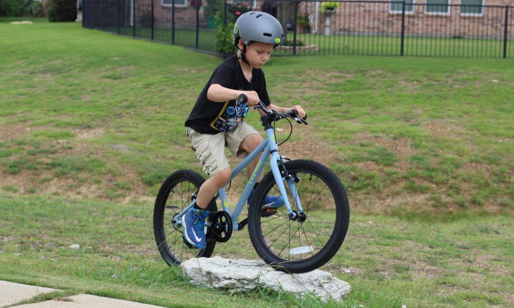 boy riding a blue Cleary Owl