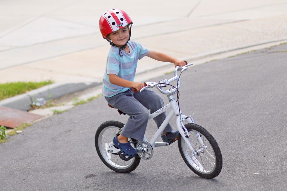 5 year old riding Priority Start 16 in his neighborhood