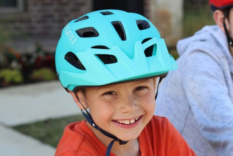 boy wearing a blue giro tremor bike helmet