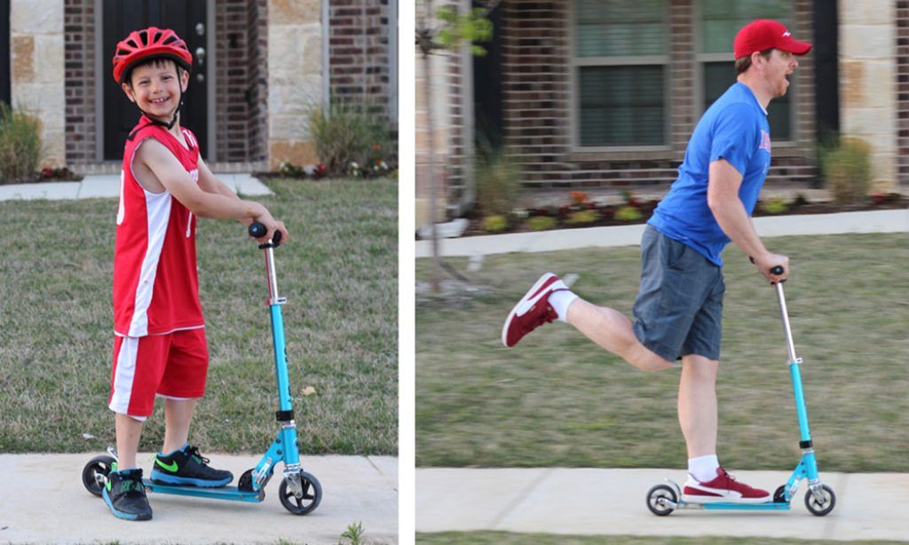 young boy and his dad riding on the micro rocket scooter