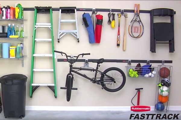 rubbermaid fasttrack system mounted to the wall of a garage