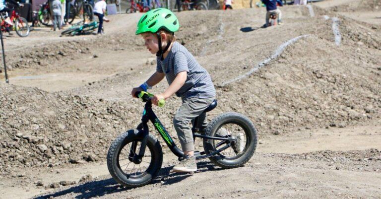 boy riding a specialized hotwalk balance bike