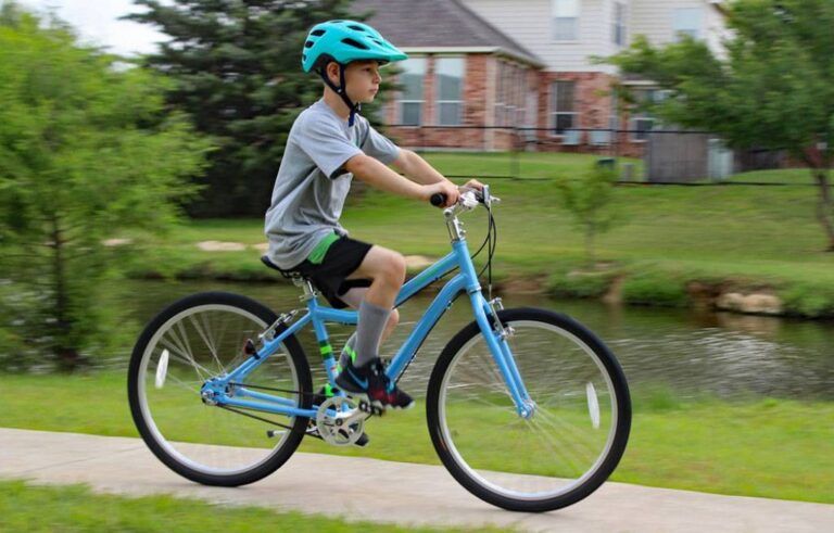 boy riding a priority start 24 inch bike