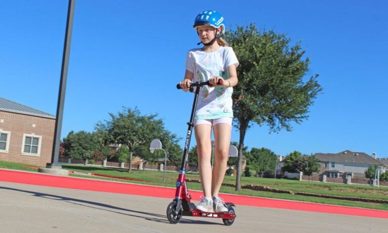 girl riding a red razor power a2 scooter