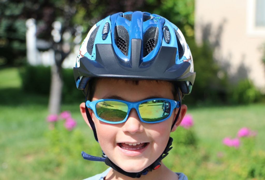 boy wearing a blue Uvex hero bike helmet