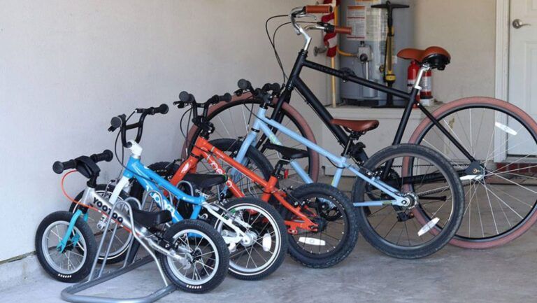 simply housewares 5 bike rack on the floor of the garage with bikes