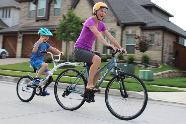 mom riding with a weeride tag along bike