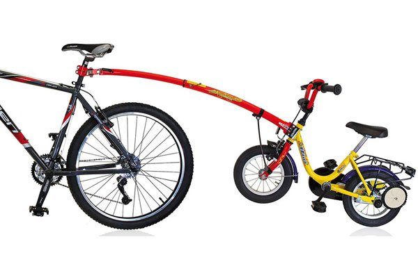trail gator kids bike tag a long attached to an adult bike