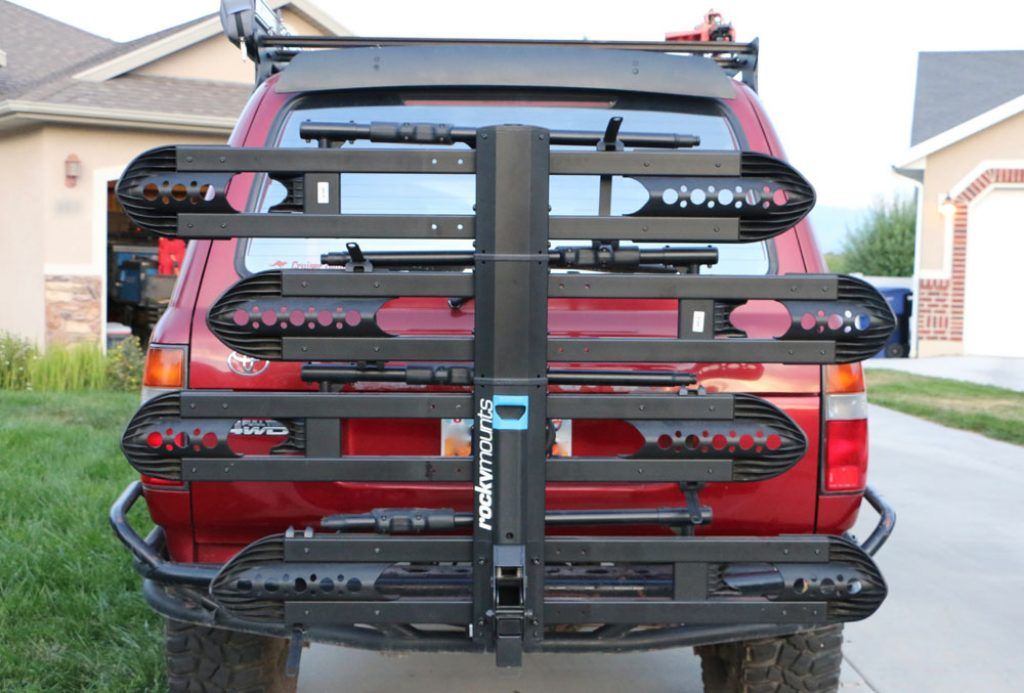 rockymounts splitrail platform bike rack folded up on back on a suv