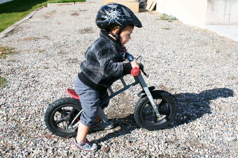 young toddler riding the FirstBIKE with a lowering kit