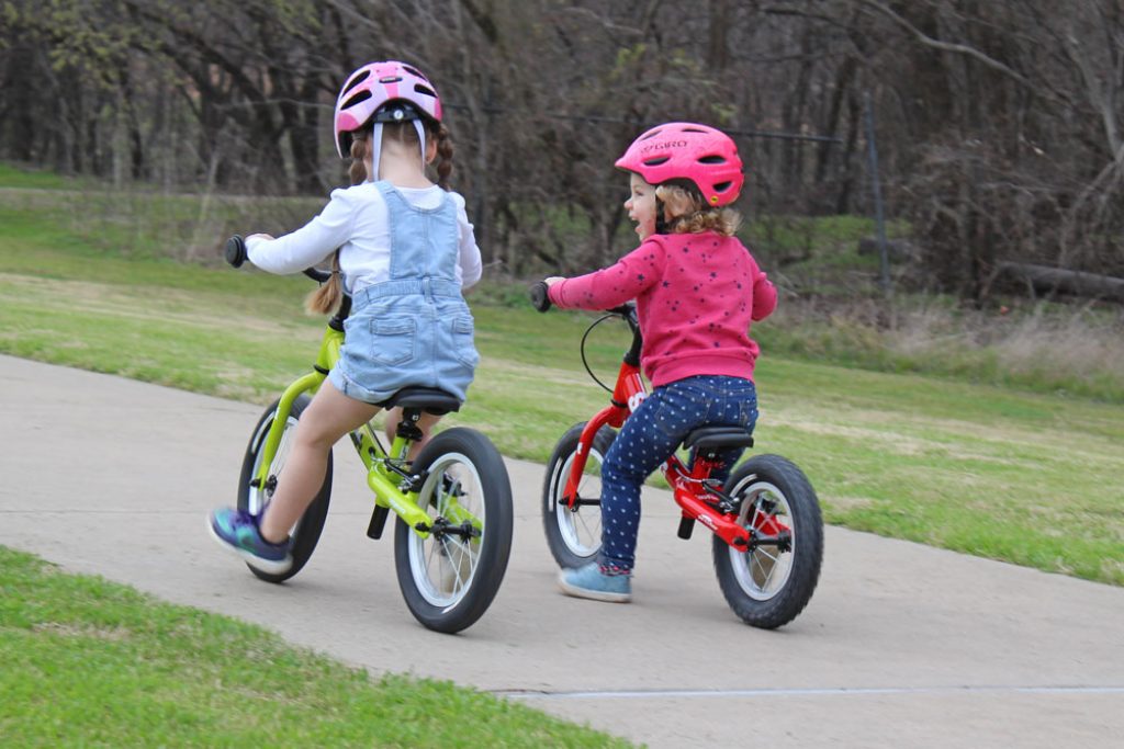 girls riding the scoot and scoot xl balance bike