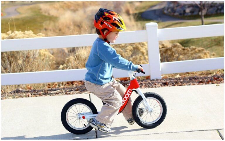 young boy riding woom 1 balance bike