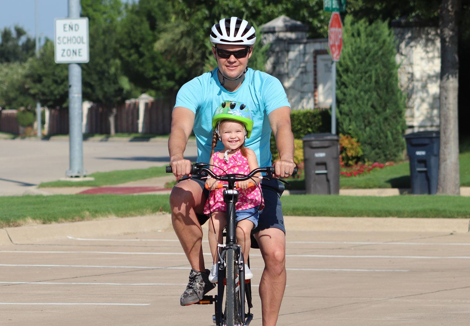 Dad riding with daughter Tyke Toter