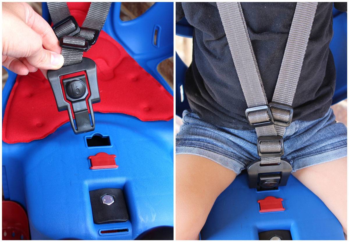 Buckle system on Bellelli Pepe child bike seat. Buckle inserts into plastic hole in the seat