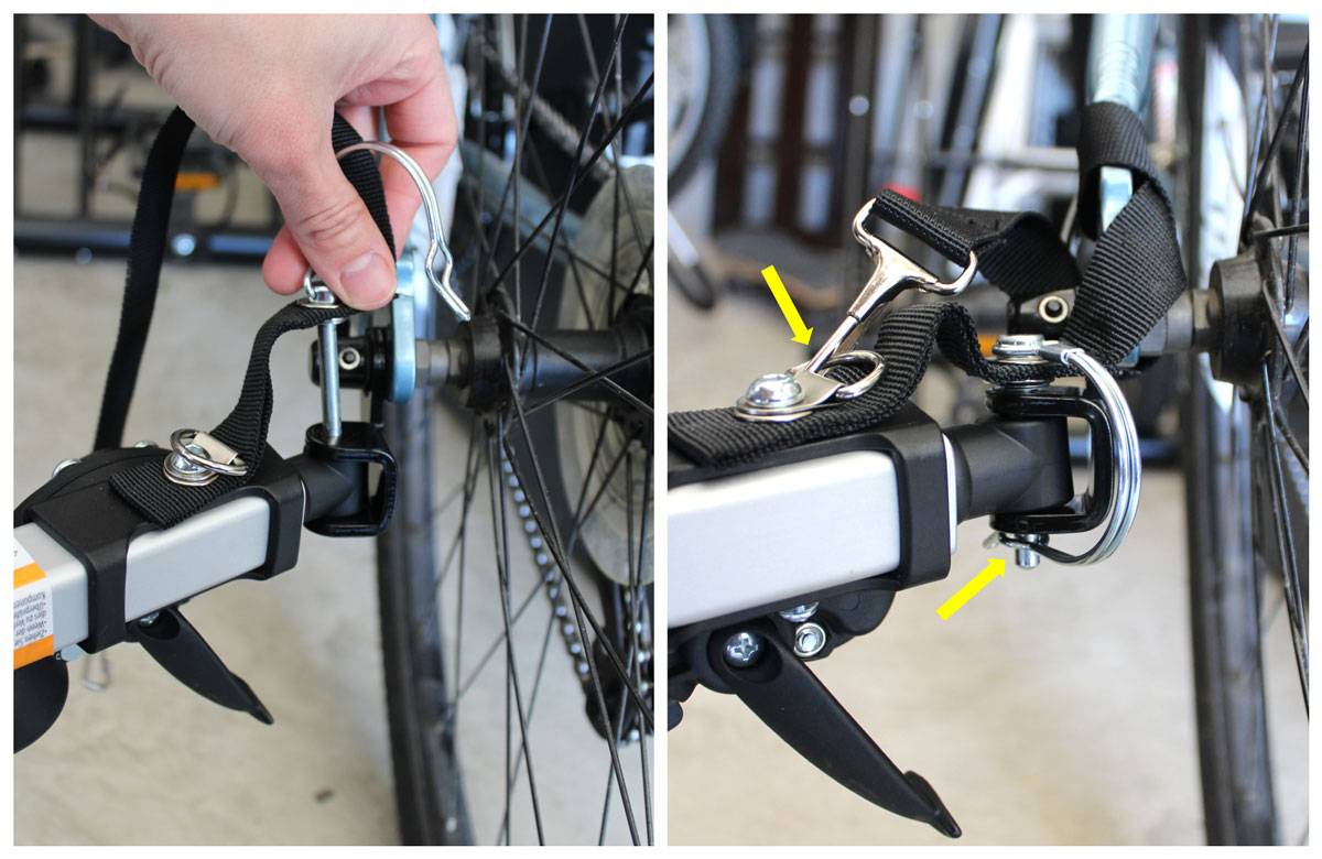 Inserting pin into connection between hitch and tow arm on Burley bike trailer