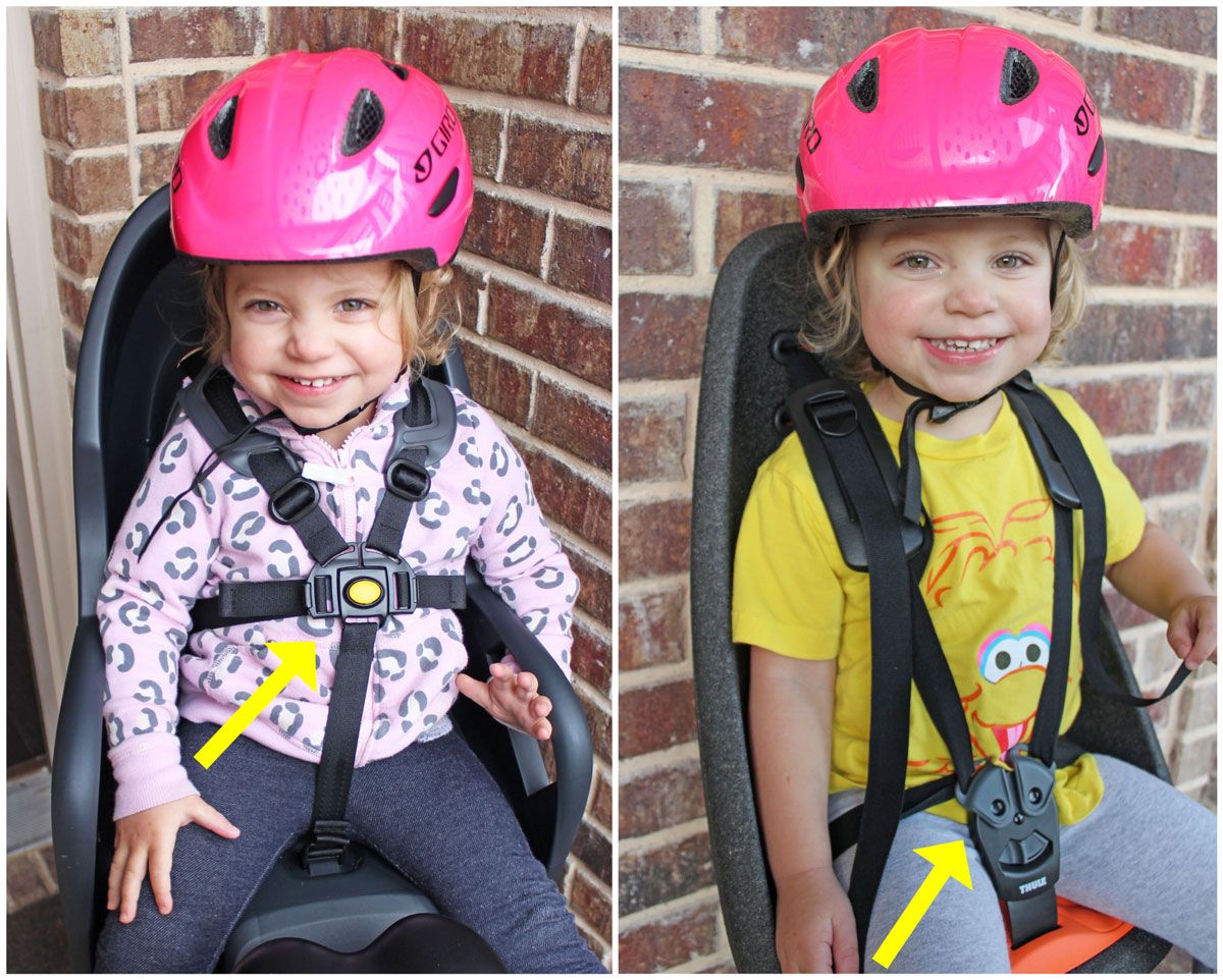 Burley Dash child bike seat buckle placement is high on the chest compared to other seats with the buckle in the crotch