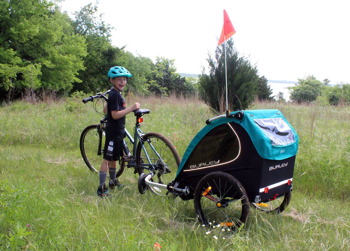 burley Encore X bike trailer on grass trail