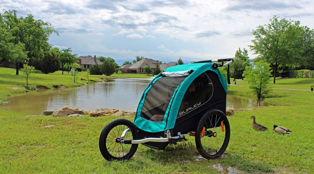 Burley Encore X bike trailer in jogger mode. By a beautiful lake.