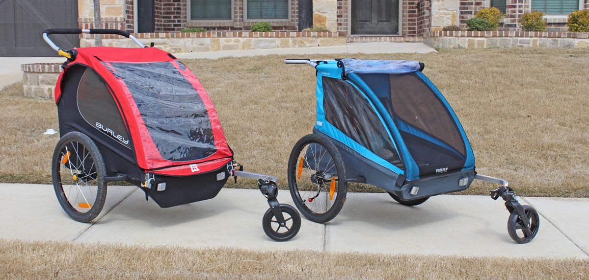 Burley Honey Bee bike trailer and Thule Coaster XT bike trailers side by side.