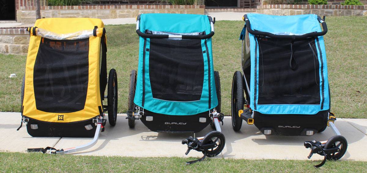 Front shot of the Burley Bee, Burley Encore X, and Burley D'Lite X bike trailers side by side