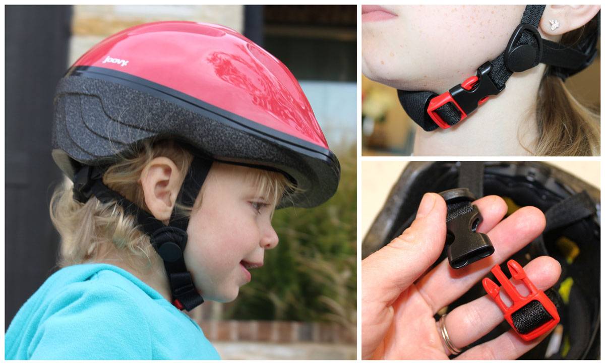 Toddler wearing Joovy Noodle helmet, showcasing side straps and buckle that is red and black.