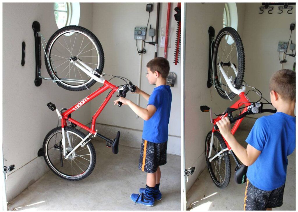 Boy putting his bike onto the Steadyrack wall bike rack