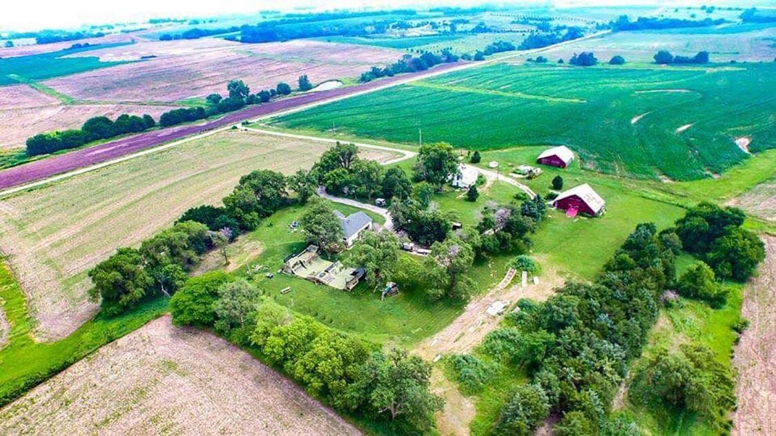 NoWear compound BMX park from the air. Surrounded by lush green farm fields.