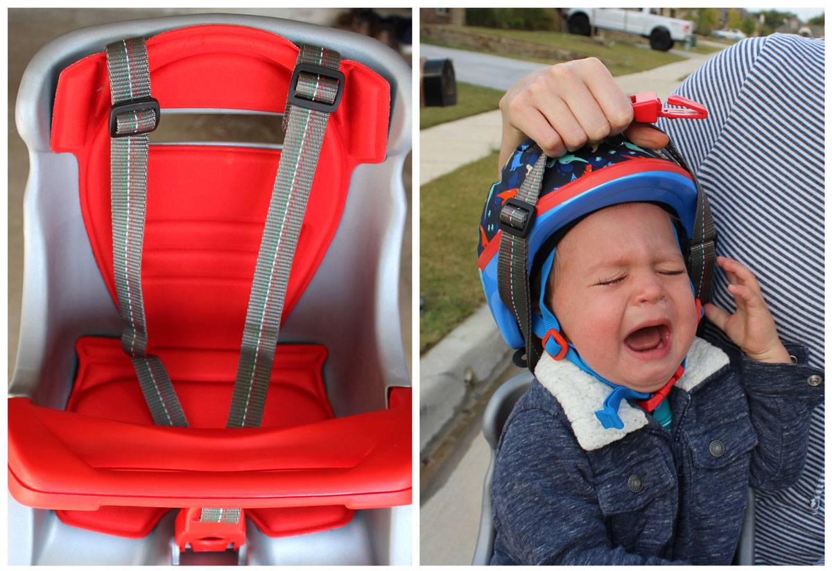 Shoulder straps being pulled over the helmet of a screaming baby in the Peg Perego Orion child bike seat