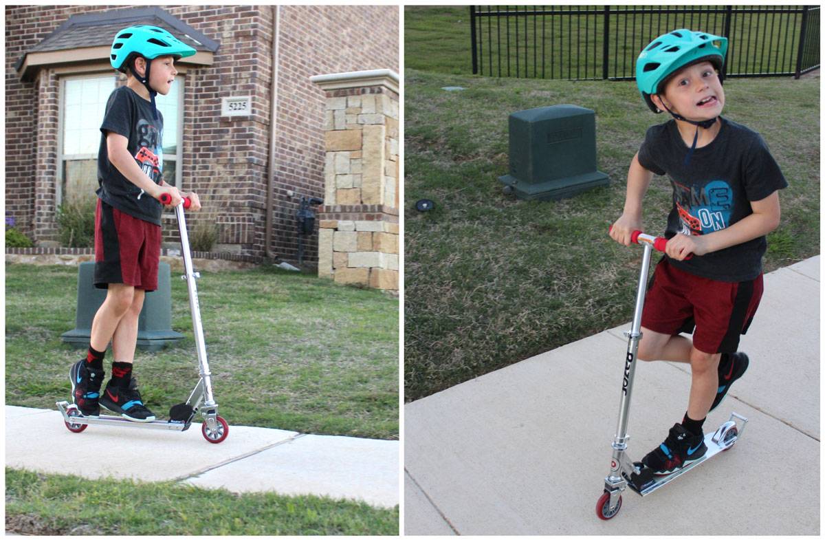 boy riding the Razor A2 kick scooter in his neighborhood
