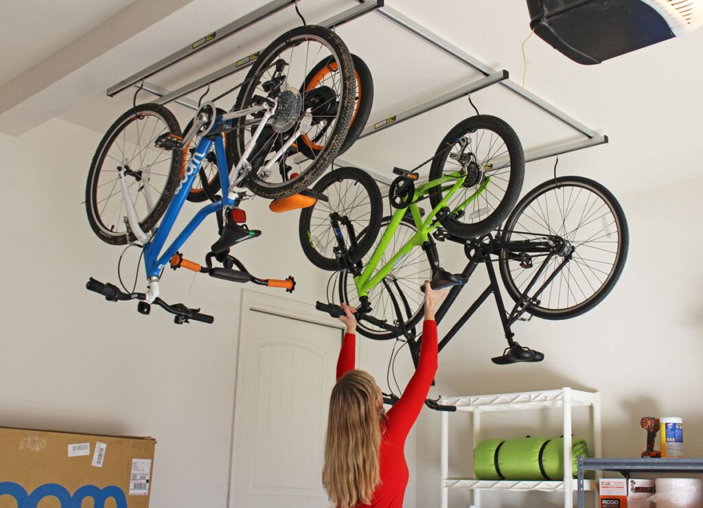 Saris cycle glide ceiling bike rack with four bikes hanging upside down