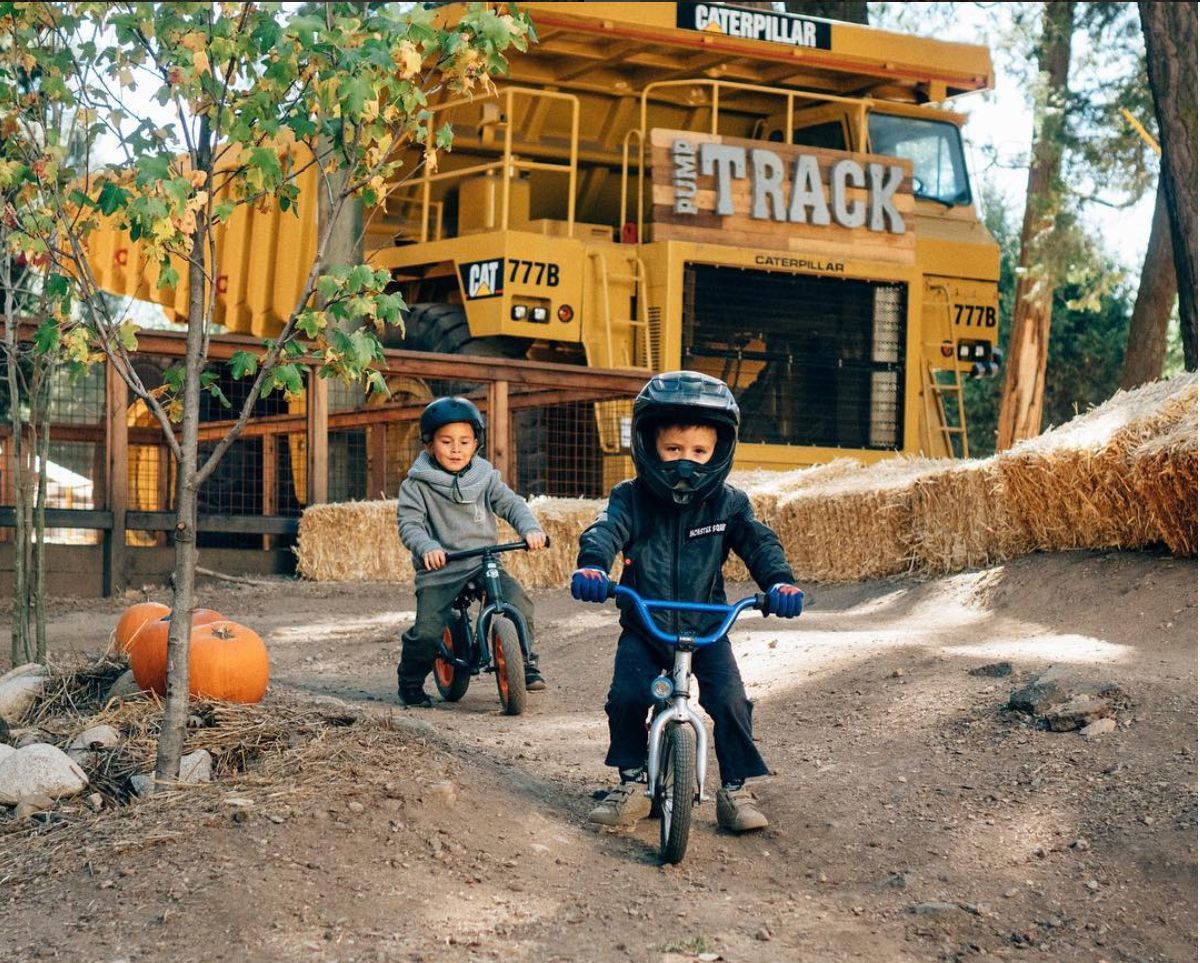 two boys on pump track at SkyPark bike park at Santa's Village Lake Arrowhead