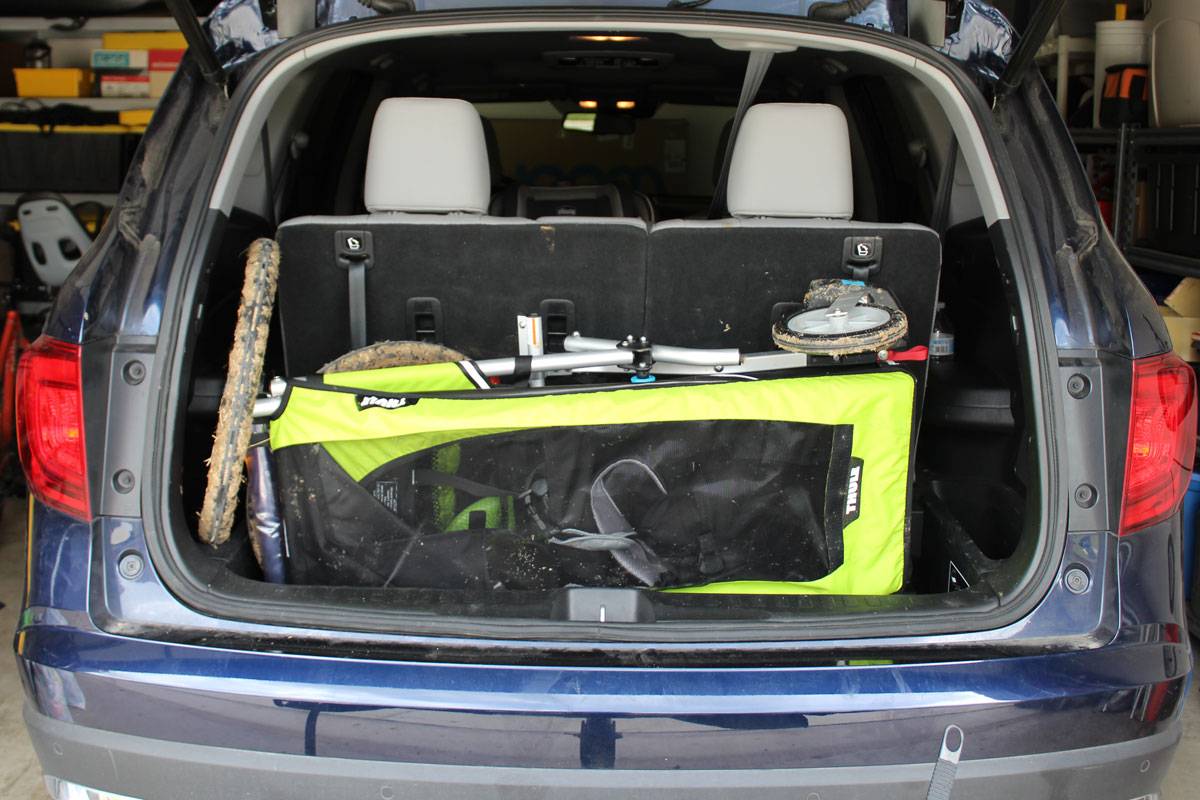 Thule Chariot Cheetah XT folded up in back of the car