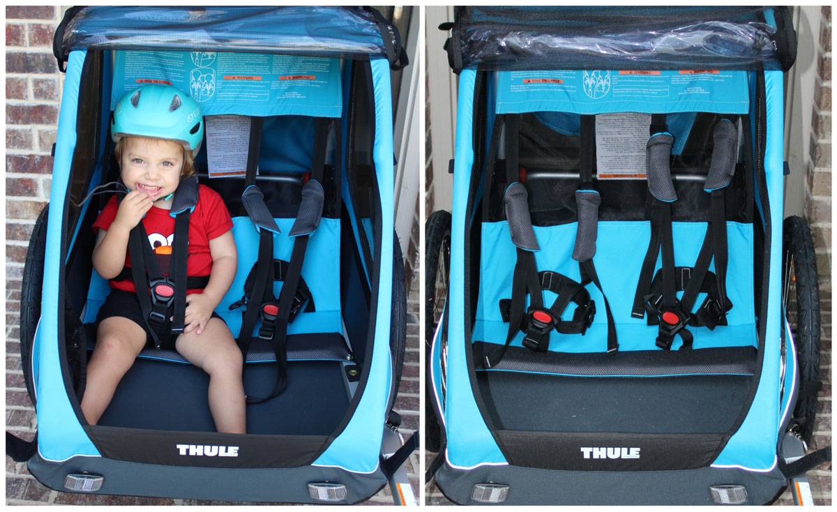 Thule Coaster XT bike trailer interior of the trailer showing seats, bottom and harnesses.