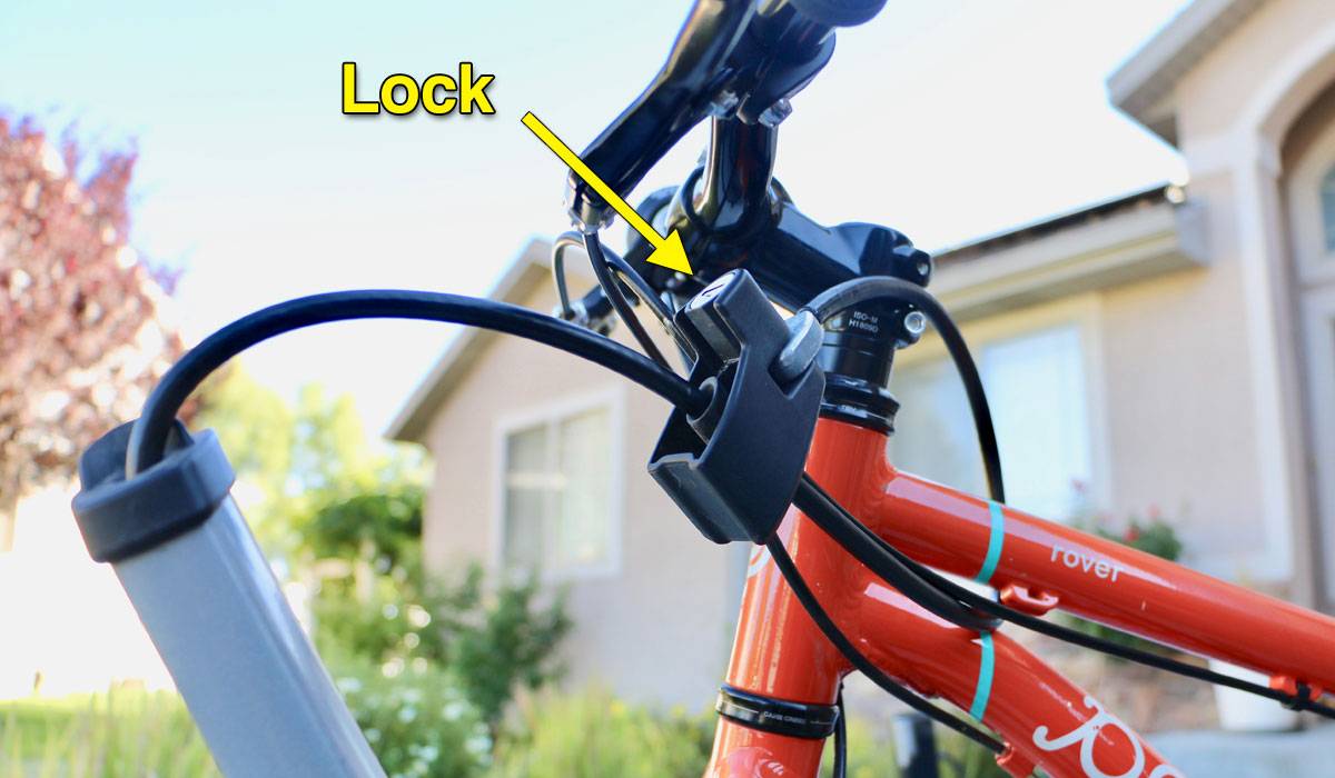 Thule T2 Pro XTR bike rack locking mechanism on a Pello kid's bike