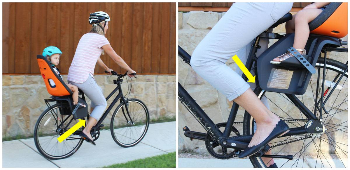 Large child leg shields on the Thule Yepp Nexxt Maxi almost coming into contact with rider's calves