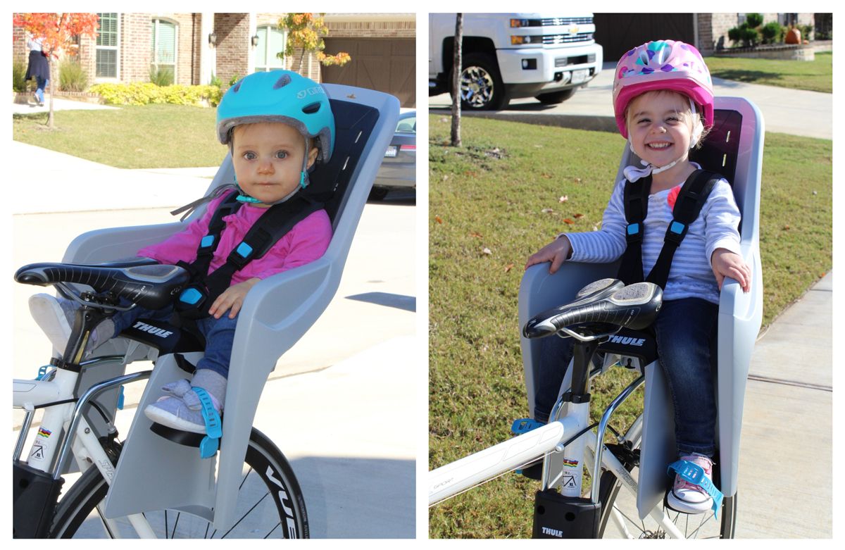 Size comparison of two kids in the Thule RideAlong Lite. 12-month-old and 2.5-year-old. 