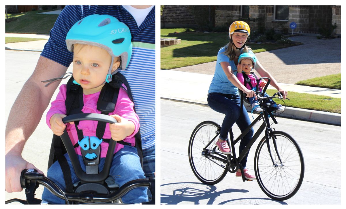 Baby in Thule Yepp Nexxt Mini grabbing onto the handlebar.