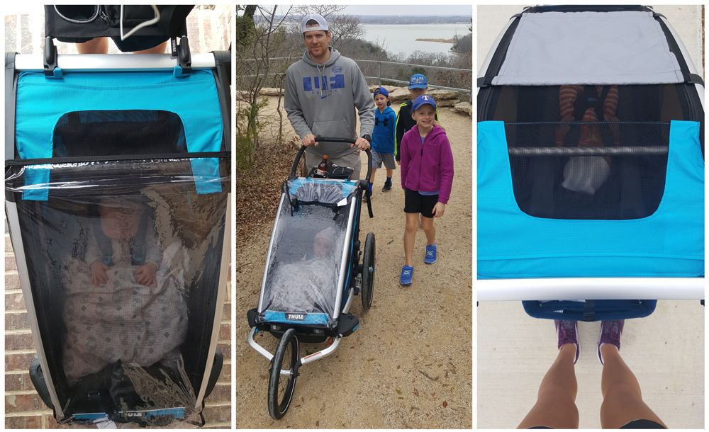 Weather cover and sun shade on Thule Cross while family is hiking.