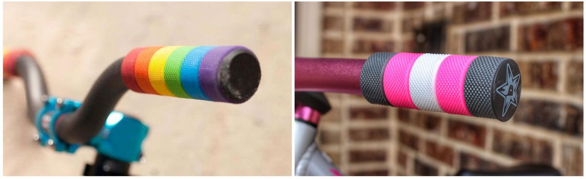 Colorful ring grips from Wild Child Bikes. One is a rainbow colored pallet, the other is white, gray and pink.