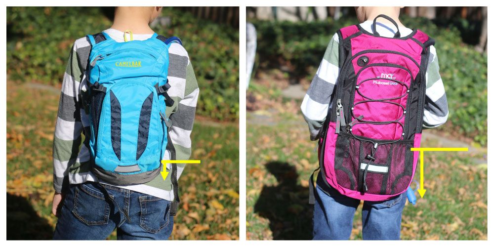 Rear shot of boy wearing Camelbak Mini MULE and a budget hydration pack. The Mini MULE sits much higher on his torso.