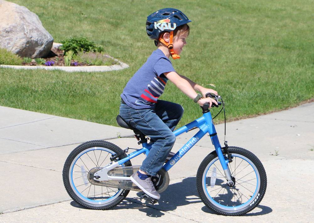 5-year-old boy riding 16" cycle kids bike in blue