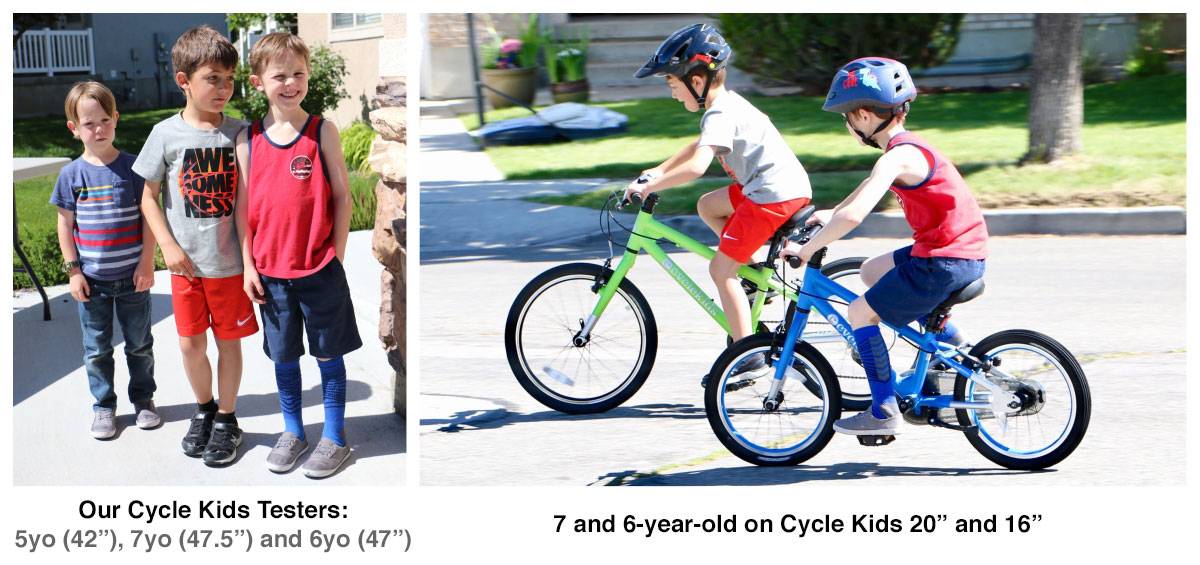 Cycle kids bike testers standing next to each other to show size differential
