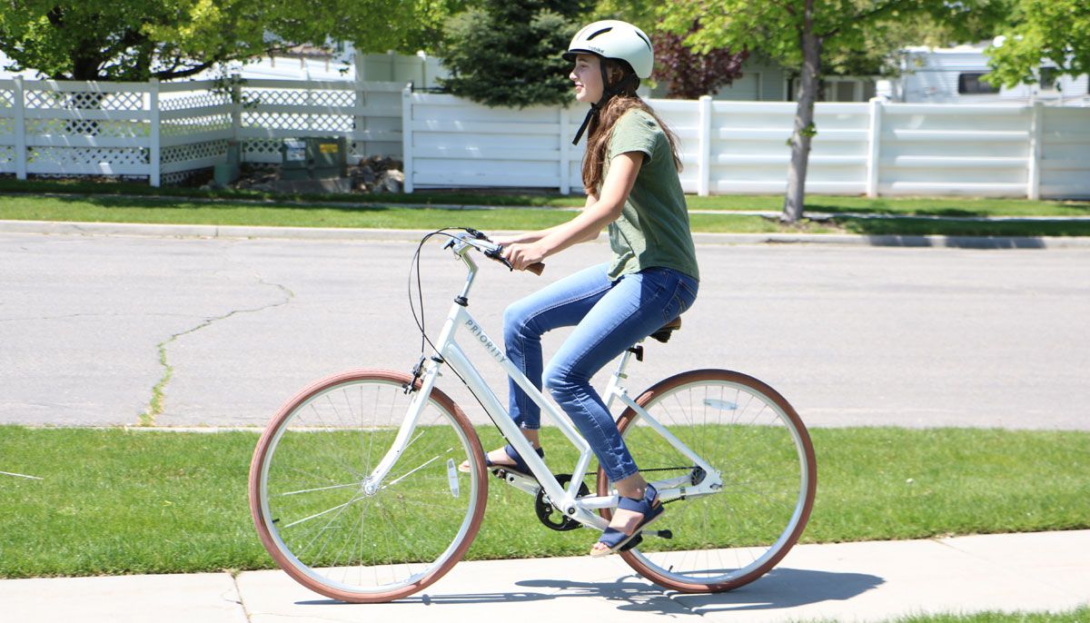 13 year old riding Priority Classic Plus bike down the sidewalk