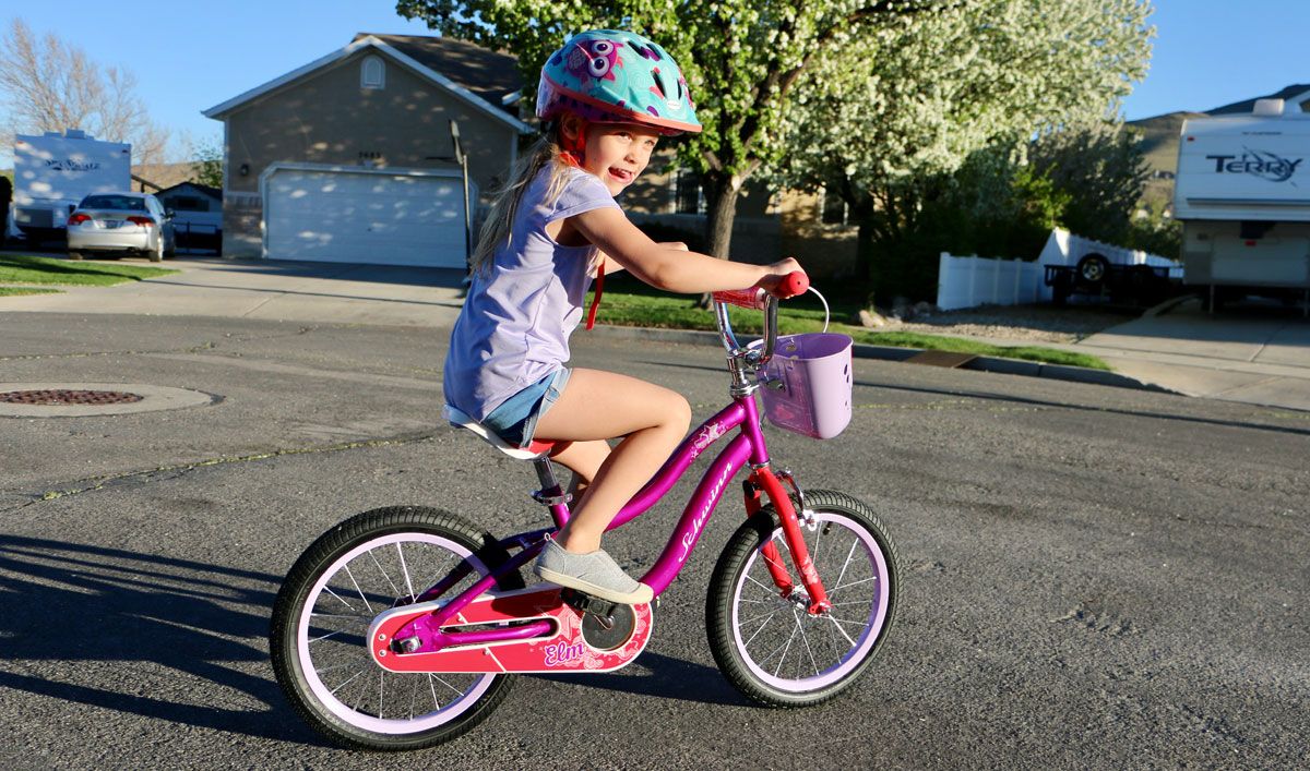 girl riding the schwinn 16 inch elm bike