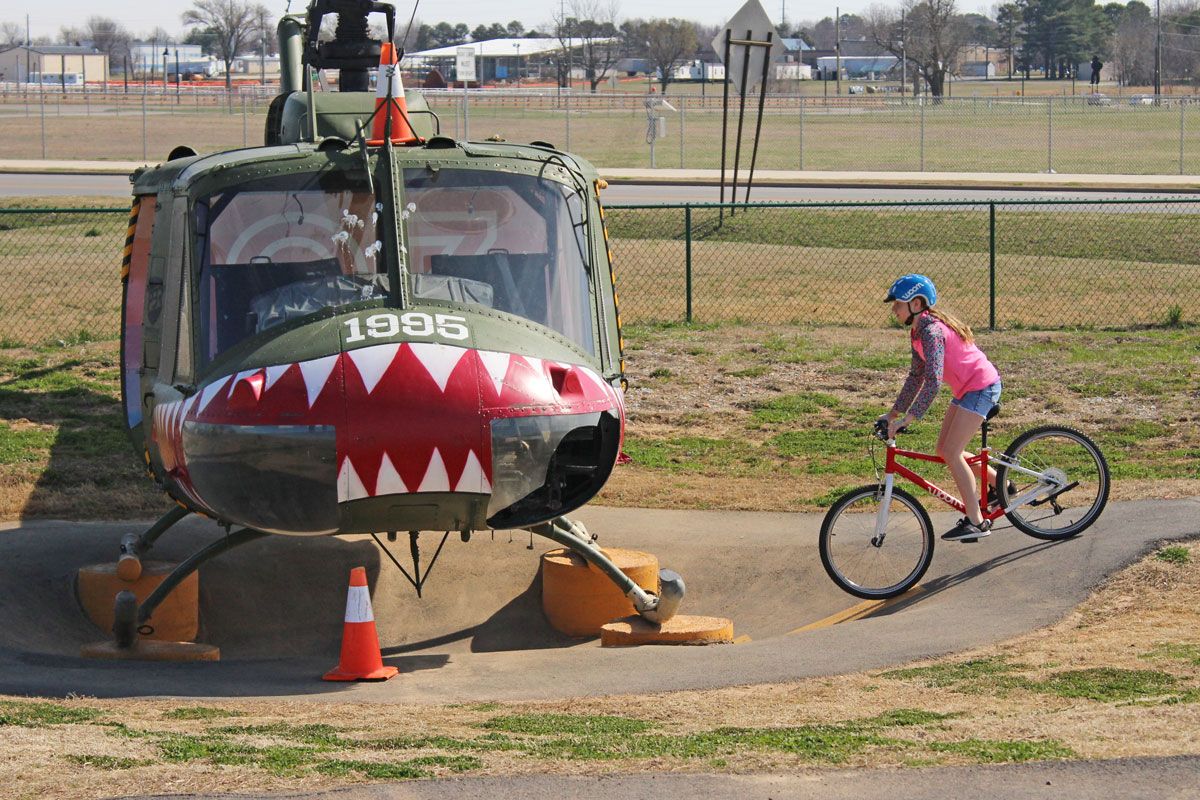 young girl riding woom 5 at Runway bike park in Springdale Arkansas