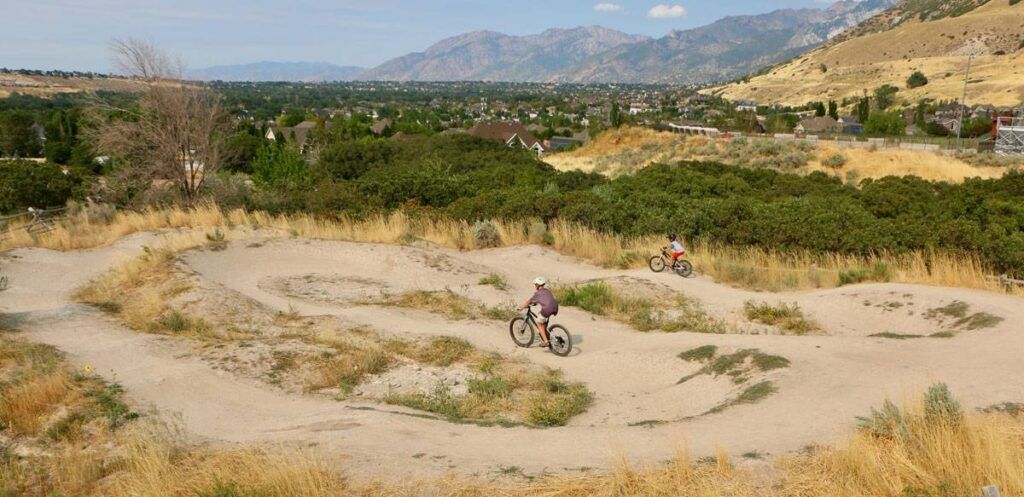 Kids riding the woom OFF at the pump track