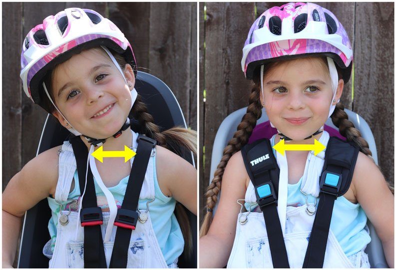 side by side comparison of 4 year old in Hamax Caress and Thule RideAlong. The Cares shoulder straps are much closer together (too close for her)