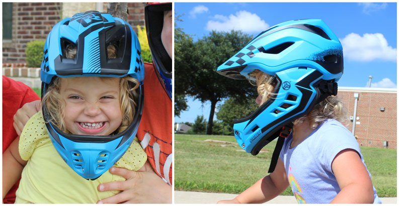 Strider full face toddler helmet worn by a toddler