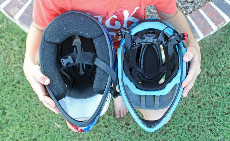 Underside of Strider Full Face helmet and Bell Sanction full face helmet. The Bell has interior padding while the Strider full face helmet does not