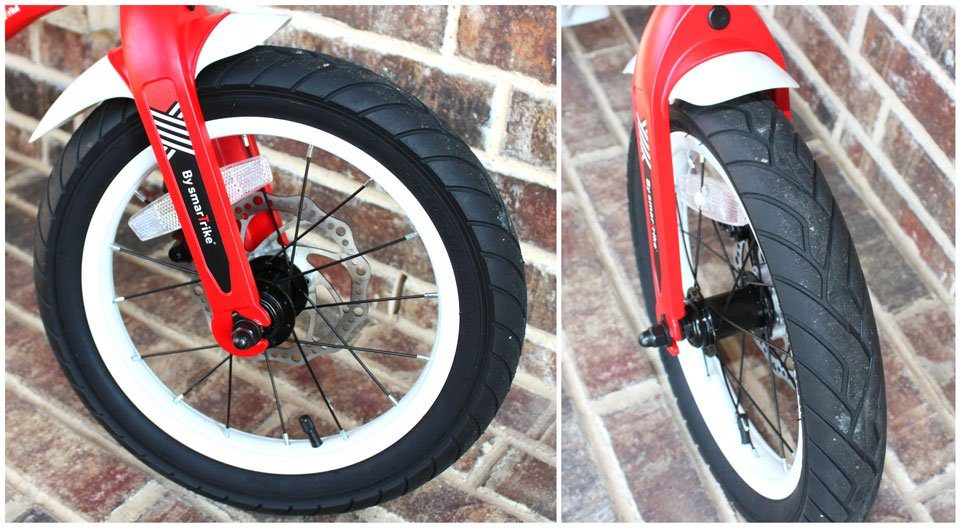 Front wheel on SmarTrike Xtend convertible balance bike, showing street treat on tire